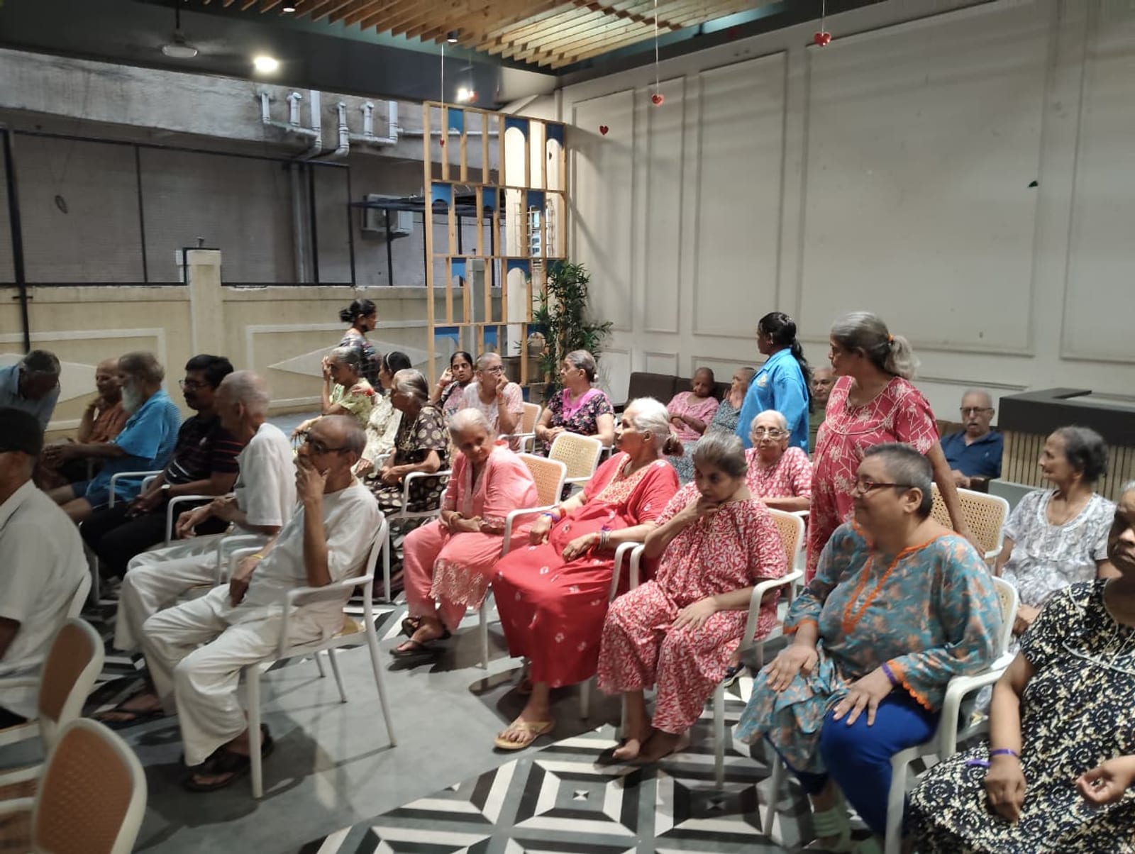 A full room, listening — the kind of connection this work is built on.
